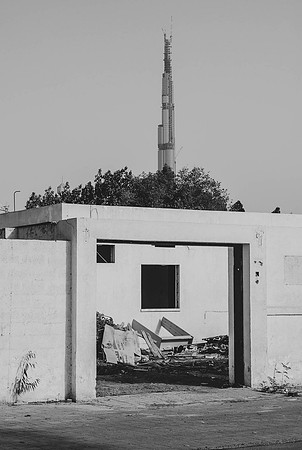 Dubai: Burj Khalifa rising above abandoned house
