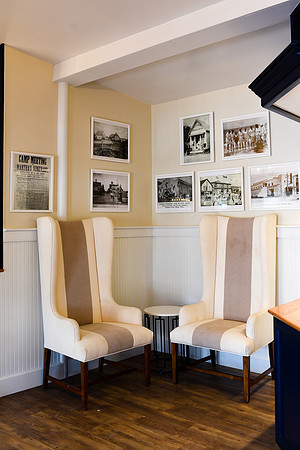 The same corner on opening day: lobby seating with historical Vineyard photographs. (June 19, 2015)