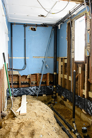 Week 5: The old restrooms stripped out with new drains laid. (May 19, 2015)